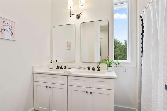 bathroom with vanity and curtained shower