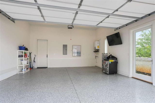 garage featuring electric panel and water heater