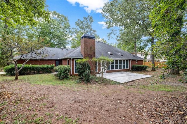 rear view of house featuring a patio