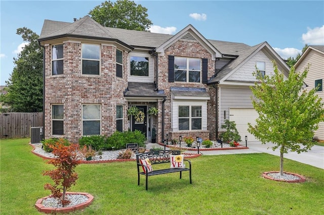 craftsman-style home with a garage, central AC unit, and a front lawn