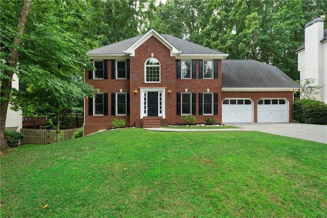 colonial-style house with a front lawn and a garage