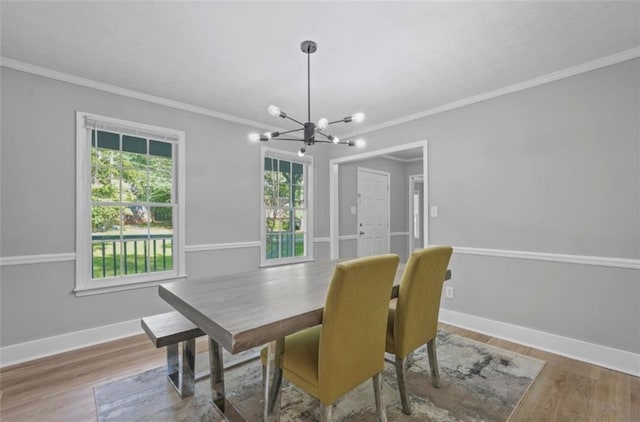 800 Post Road Cir, Stone Mountain, GA 30088 - dining area featuring a chandelier, ornamental molding, wood finished floors, and baseboards