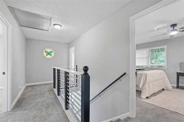 800 Post Road Cir, Stone Mountain, GA 30088 - corridor featuring an upstairs landing, carpet, baseboards, and a textured ceiling