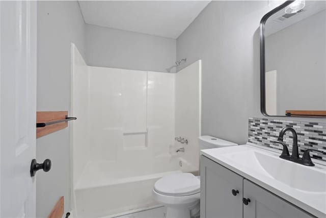 800 Post Road Cir, Stone Mountain, GA 30088 - bathroom featuring toilet, vanity, backsplash, and bathing tub / shower combination