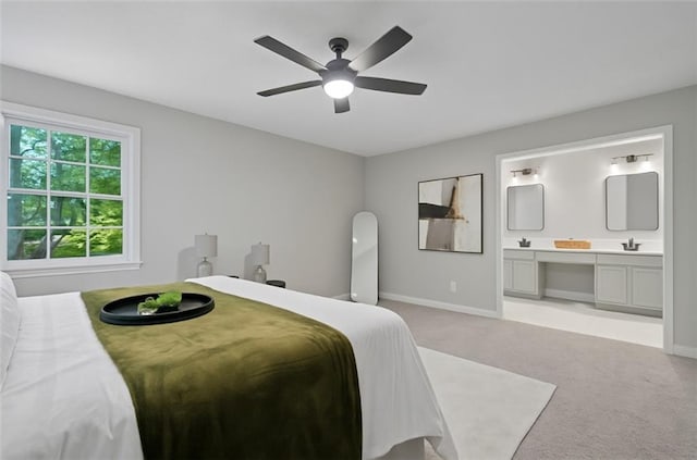 800 Post Road Cir, Stone Mountain, GA 30088 - bedroom featuring light colored carpet, baseboards, a sink, connected bathroom, and a ceiling fan