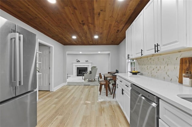 800 Post Road Cir, Stone Mountain, GA 30088 - kitchen with appliances with stainless steel finishes, wooden ceiling, recessed lighting, light wood-type flooring, and decorative backsplash