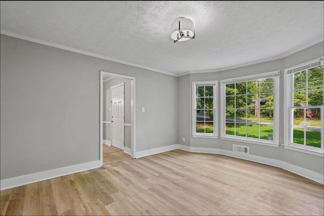 800 Post Road Cir, Stone Mountain, GA 30088 - spare room with light wood-style floors, a textured ceiling, baseboards, and crown molding