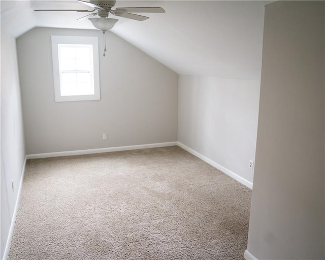 bonus room with ceiling fan, carpet floors, and vaulted ceiling