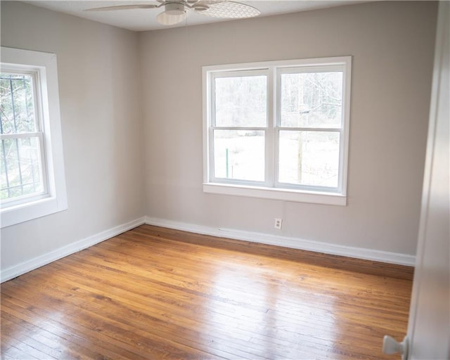 empty room featuring light hardwood / wood-style flooring and ceiling fan