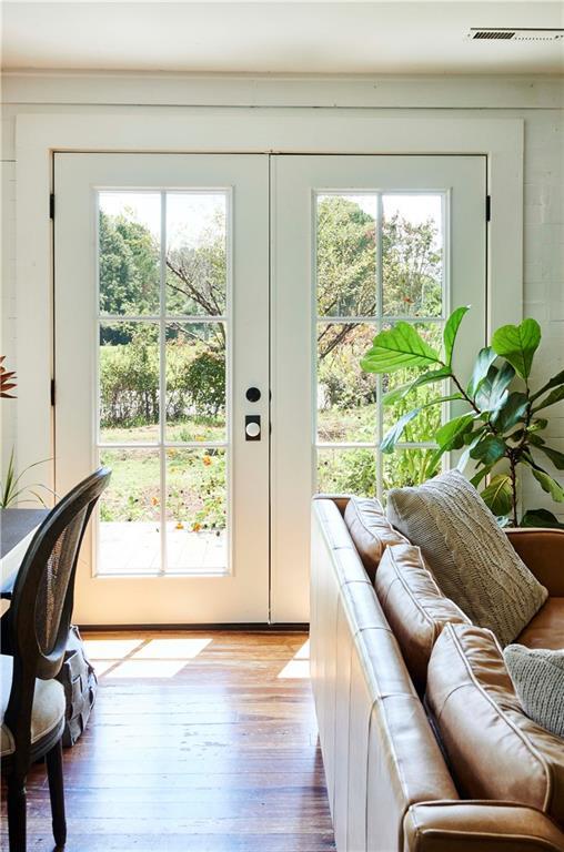 entryway featuring a wealth of natural light and light hardwood / wood-style flooring