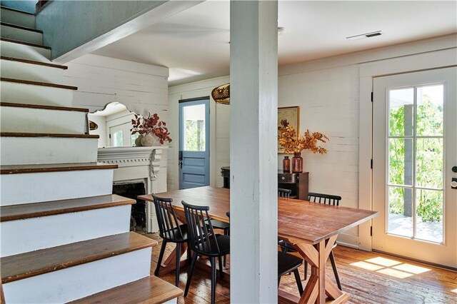 dining room with a healthy amount of sunlight and light wood-type flooring