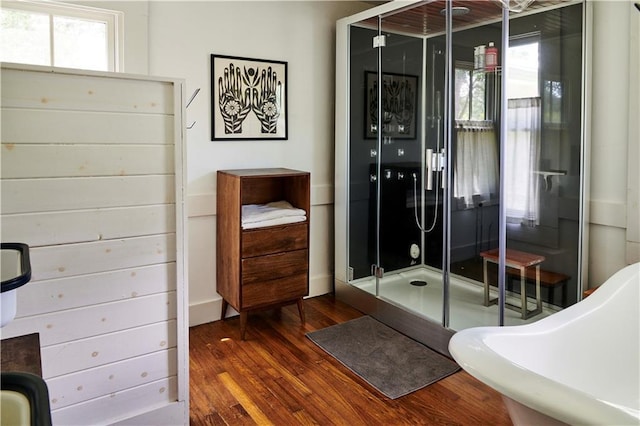 bathroom featuring an enclosed shower and hardwood / wood-style floors