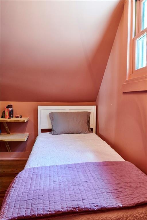 bedroom featuring lofted ceiling