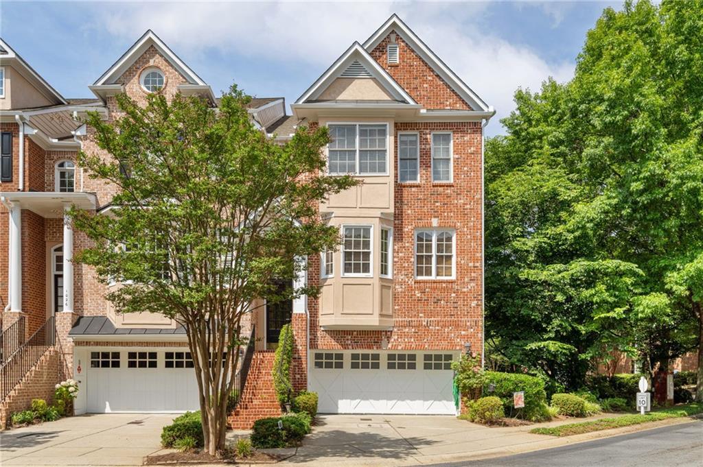 1028 Emory Parc Pl, Decatur, GA 30033 - townhome / multi-family property with a garage