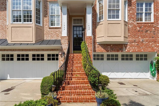 view of exterior entry with a garage