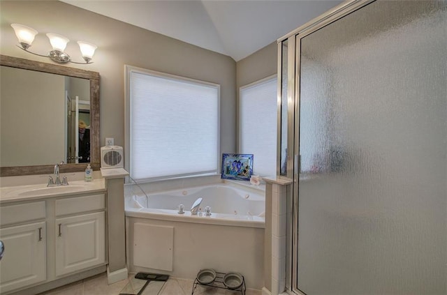 bathroom with vanity, shower with separate bathtub, tile patterned flooring, and vaulted ceiling