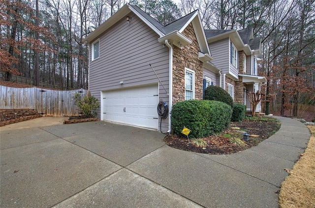 view of side of home featuring a garage