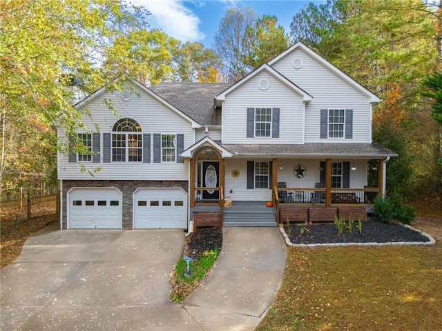 view of front of property featuring a porch and a garage