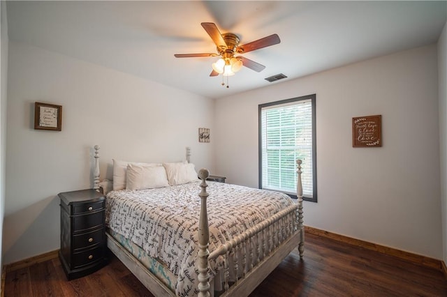 bedroom featuring ceiling fan and dark hardwood / wood-style floors