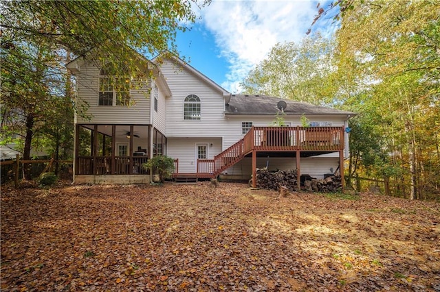 rear view of property with a deck, ceiling fan, and a sunroom