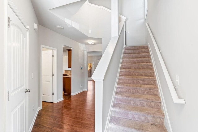 staircase featuring hardwood / wood-style floors