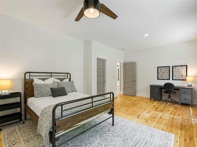 bedroom with baseboards, recessed lighting, ceiling fan, and light wood-style flooring