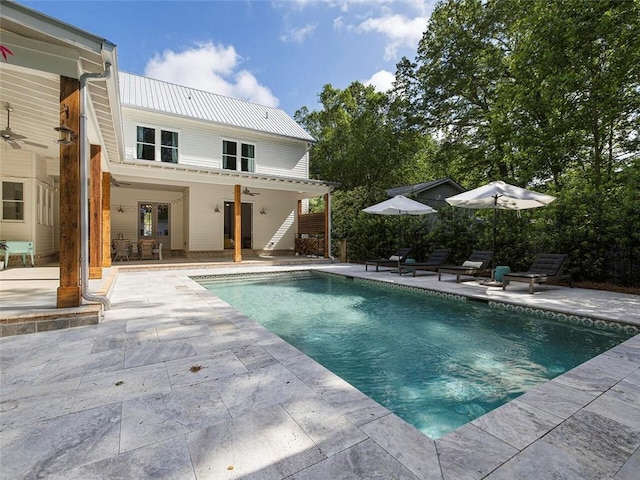 view of pool with a patio, ceiling fan, a fenced in pool, and stairs