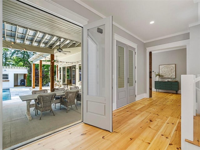 doorway to outside featuring wood-type flooring, french doors, a ceiling fan, recessed lighting, and ornamental molding