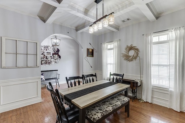 1751 Fire Side Ct, Jefferson, GA 30549 - dining space featuring crown molding, coffered ceiling, arched walkways, plenty of natural light, and beam ceiling