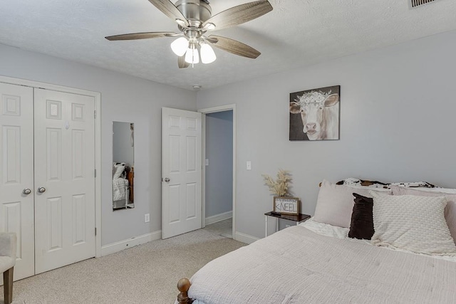 1751 Fire Side Ct, Jefferson, GA 30549 - bedroom featuring light colored carpet, a ceiling fan, a closet, and a textured ceiling