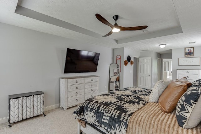 1751 Fire Side Ct, Jefferson, GA 30549 - carpeted bedroom featuring a raised ceiling, a textured ceiling, and ceiling fan