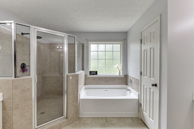1751 Fire Side Ct, Jefferson, GA 30549 - full bath featuring a garden tub, a stall shower, tile patterned floors, and a textured ceiling