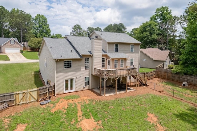 1751 Fire Side Ct, Jefferson, GA 30549 - back of house featuring a wooden deck, stairs, a fenced backyard, and a gate