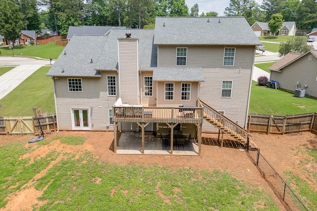1751 Fire Side Ct, Jefferson, GA 30549 - rear view of property featuring a patio, a deck, a fenced backyard, a chimney, and stairway