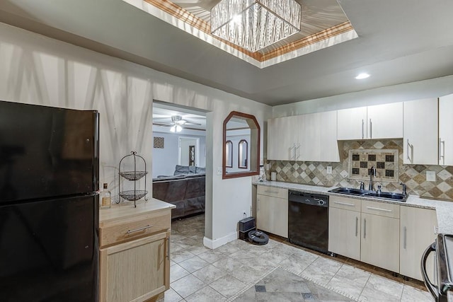 1751 Fire Side Ct, Jefferson, GA 30549 - kitchen with black appliances, light countertops, backsplash, a tray ceiling, and ceiling fan