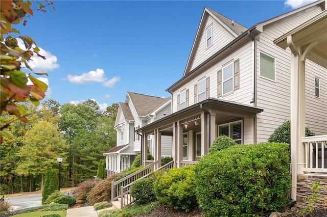 view of property exterior featuring covered porch