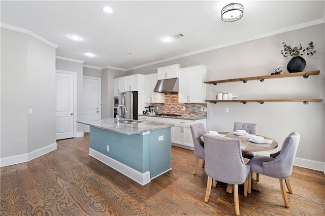 kitchen with dark wood-style floors, decorative backsplash, white cabinets, under cabinet range hood, and baseboards