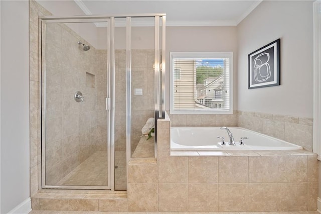 bathroom featuring a stall shower, crown molding, and a bath