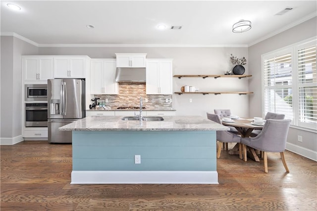 kitchen featuring dark wood-style floors, appliances with stainless steel finishes, and ornamental molding