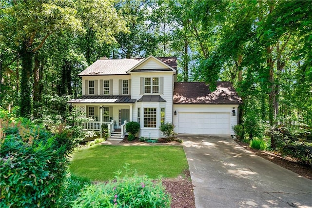 404 Summerchase Way, Woodstock, GA 30189 - view of front of home with driveway, an attached garage, covered porch, a front yard, and a standing seam roof