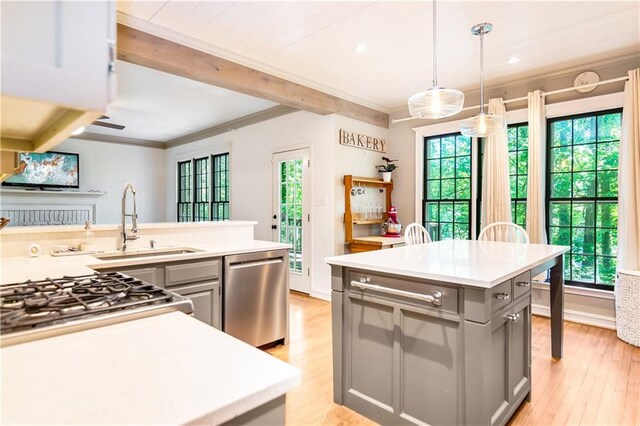 404 Summerchase Way, Woodstock, GA 30189 - kitchen featuring stainless steel dishwasher, gray cabinetry, a sink, light countertops, and beam ceiling
