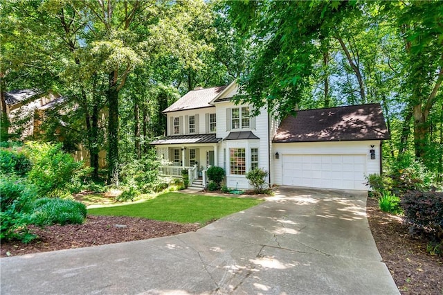404 Summerchase Way, Woodstock, GA 30189 - view of front of home featuring concrete driveway, an attached garage, a porch, a front yard, and a standing seam roof