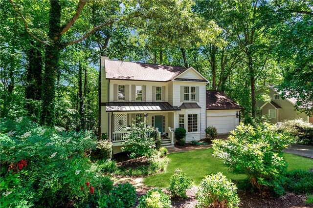 404 Summerchase Way, Woodstock, GA 30189 - view of front of home with a porch, a standing seam roof, metal roof, a chimney, and a front yard