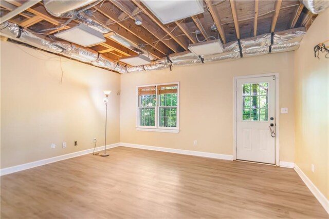 404 Summerchase Way, Woodstock, GA 30189 - below grade area with healthy amount of natural light, wood finished floors, and baseboards