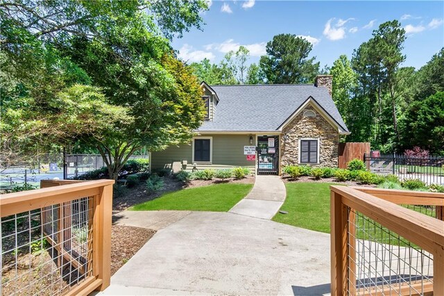 404 Summerchase Way, Woodstock, GA 30189 - view of front of property featuring stone siding, a chimney, and roof with shingles