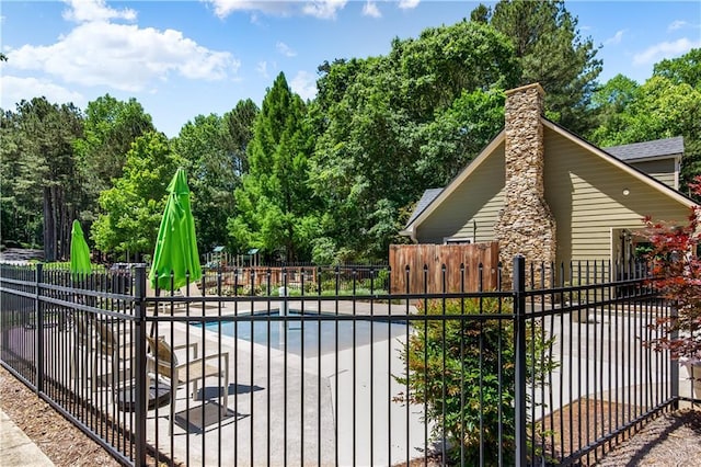 404 Summerchase Way, Woodstock, GA 30189 - view of pool with a patio and view of wooded area