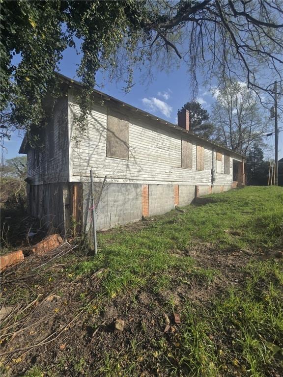 2279 Clayton St, Macon, GA 31204 - view of side of home featuring a chimney