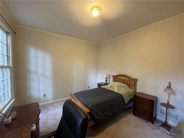 bedroom featuring ornamental molding and light carpet