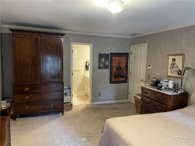 carpeted bedroom with crown molding and ensuite bath