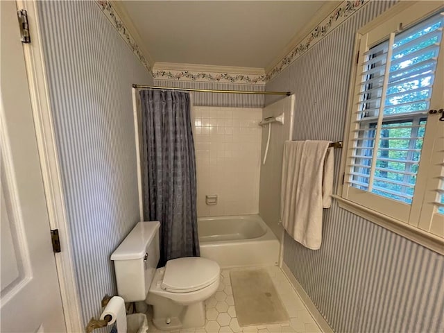 bathroom with toilet, ornamental molding, tile patterned flooring, and shower / tub combo with curtain